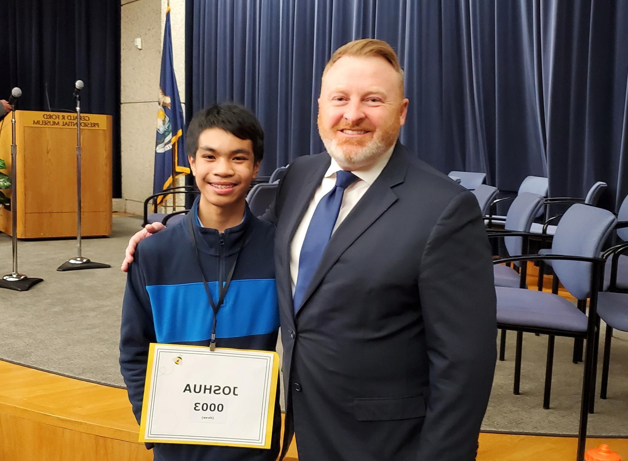 Kent ISD Superintendent Ron Gorman and Spelling Bee winner Joshua Diocares